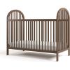 imageGraco Olivia Convertible Crib Black  GREENGUARD Gold Certified 100 Solid Wood Fits Standard Crib Mattress Converts to Toddler Bed and Daybed 4 Adjustable Mattress HeightsHazelnut