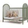 imageGraco Olivia Convertible Crib Black  GREENGUARD Gold Certified 100 Solid Wood Fits Standard Crib Mattress Converts to Toddler Bed and Daybed 4 Adjustable Mattress HeightsOlive
