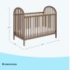 imageGraco Olivia Convertible Crib Black  GREENGUARD Gold Certified 100 Solid Wood Fits Standard Crib Mattress Converts to Toddler Bed and Daybed 4 Adjustable Mattress HeightsHazelnut