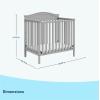 imageGraco Stella 4in1 Convertible Mini Crib with Bonus Mattress Pebble Gray  Includes Bonus 275 Inch Thick Mattress with WaterResistant Cover Converts to Twin Bed Ideal Crib for Small SpacesPebble Gray