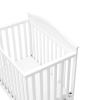 imageGraco Stella 4in1 Convertible Mini Crib with Bonus Mattress Pebble Gray  Includes Bonus 275 Inch Thick Mattress with WaterResistant Cover Converts to Twin Bed Ideal Crib for Small SpacesWhite