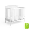 imageGraco Stella 4in1 Convertible Mini Crib with Bonus Mattress Pebble Gray  Includes Bonus 275 Inch Thick Mattress with WaterResistant Cover Converts to Twin Bed Ideal Crib for Small SpacesWhite