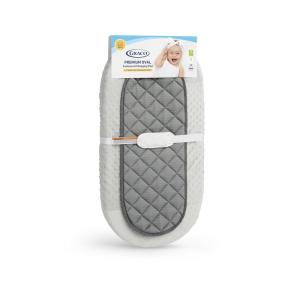 imageGraco Premium Oval Contoured Changing Pad with Bonus Cover and WaterResistant Liner  GREENGUARD Gold Certified CocoonLike Oval Contoured Shape Fits All Standard Changing Toppers UltraSoft Cover