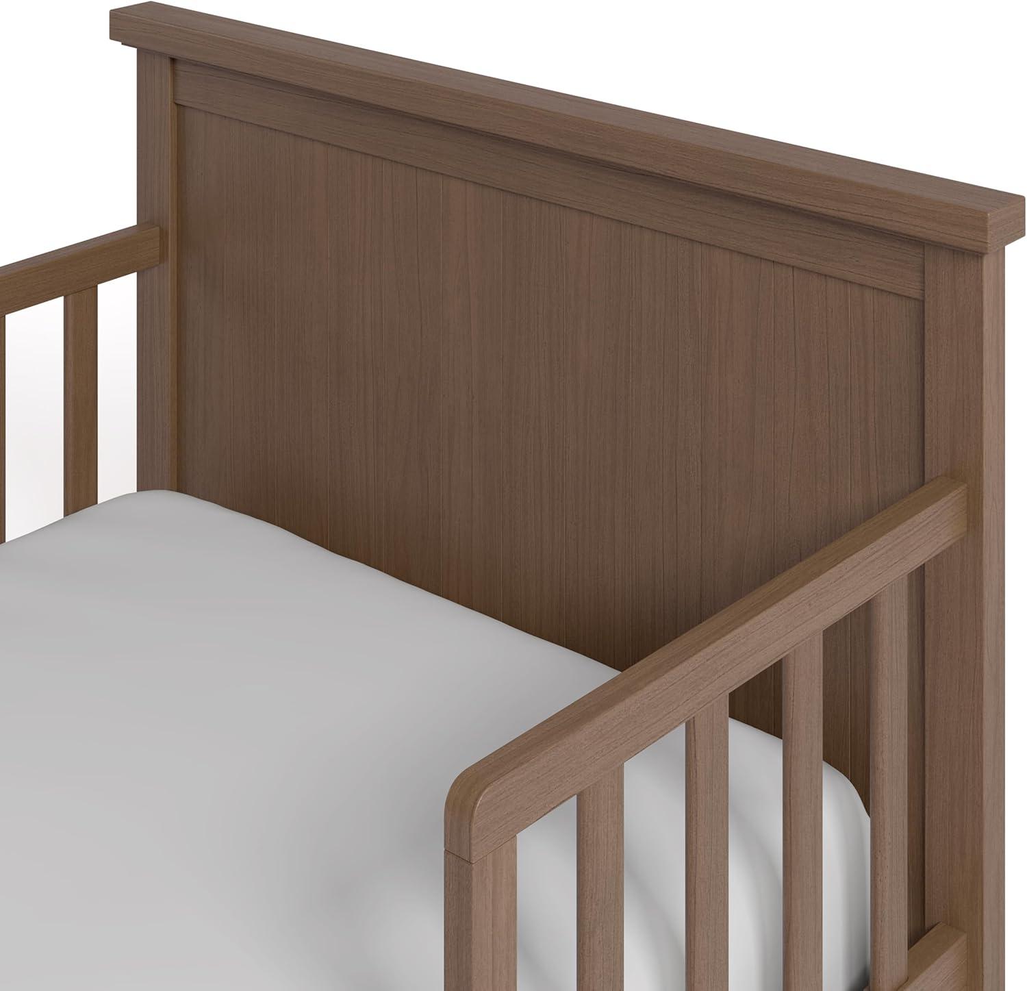 imageGraco Bailey Toddler Bed Pebble Gray  GREENGUARD Gold Certified Fits Standard FullSize Crib ampamp Toddler Mattress Toddler Safety Guardrails Included Complete Design with Solid Headboard FootboardHazelnut