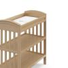 imageGraco Benton Changing Table with Bonus WaterResistant Changing Pad White  GREENGUARD Gold Certified Includes Diaper Change Pad with Safety Strap 2 Open Storage Shelves for OrganizingDriftwood